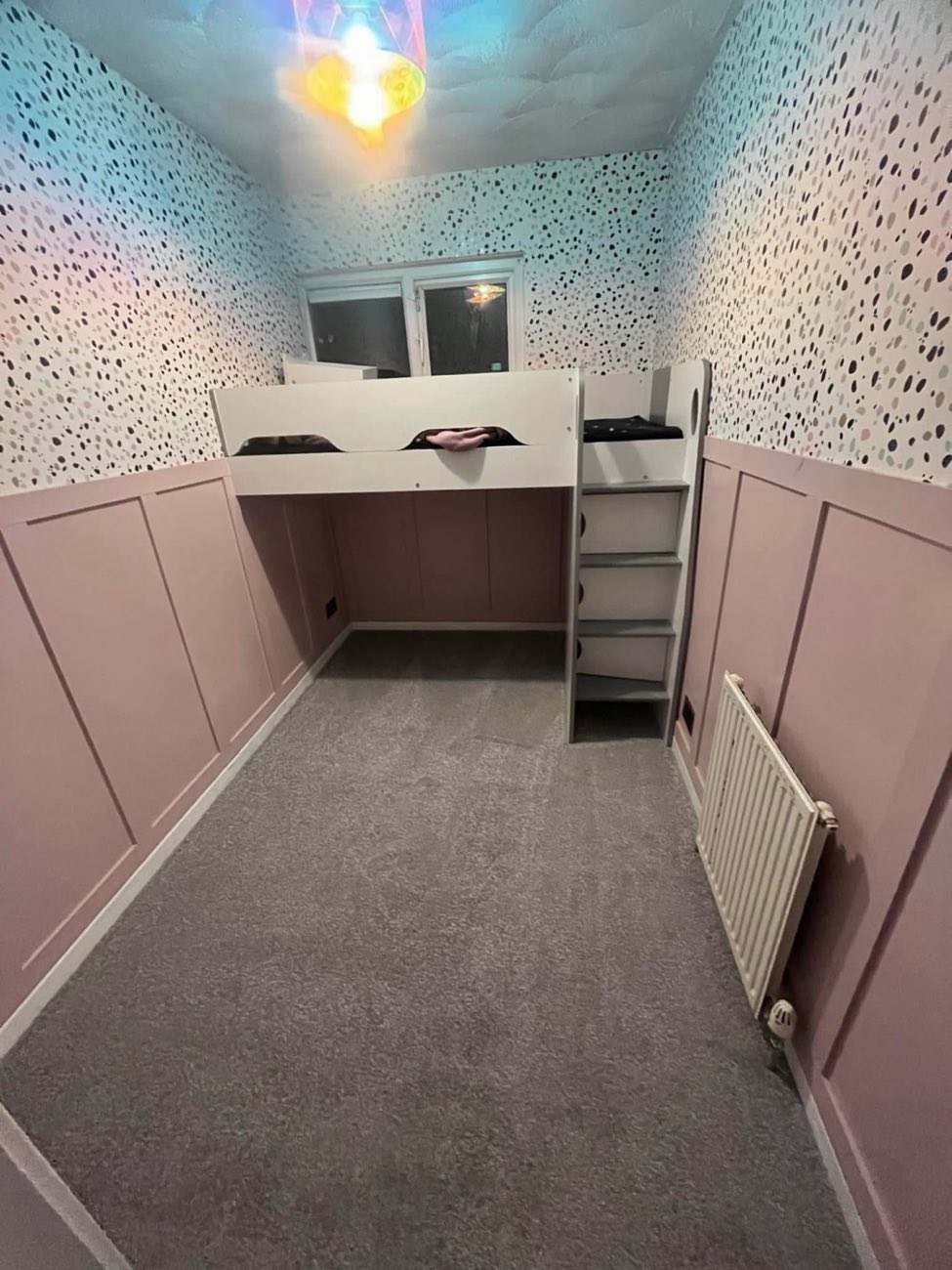 Child's bedroom with wall panelling and built-in cabin bed